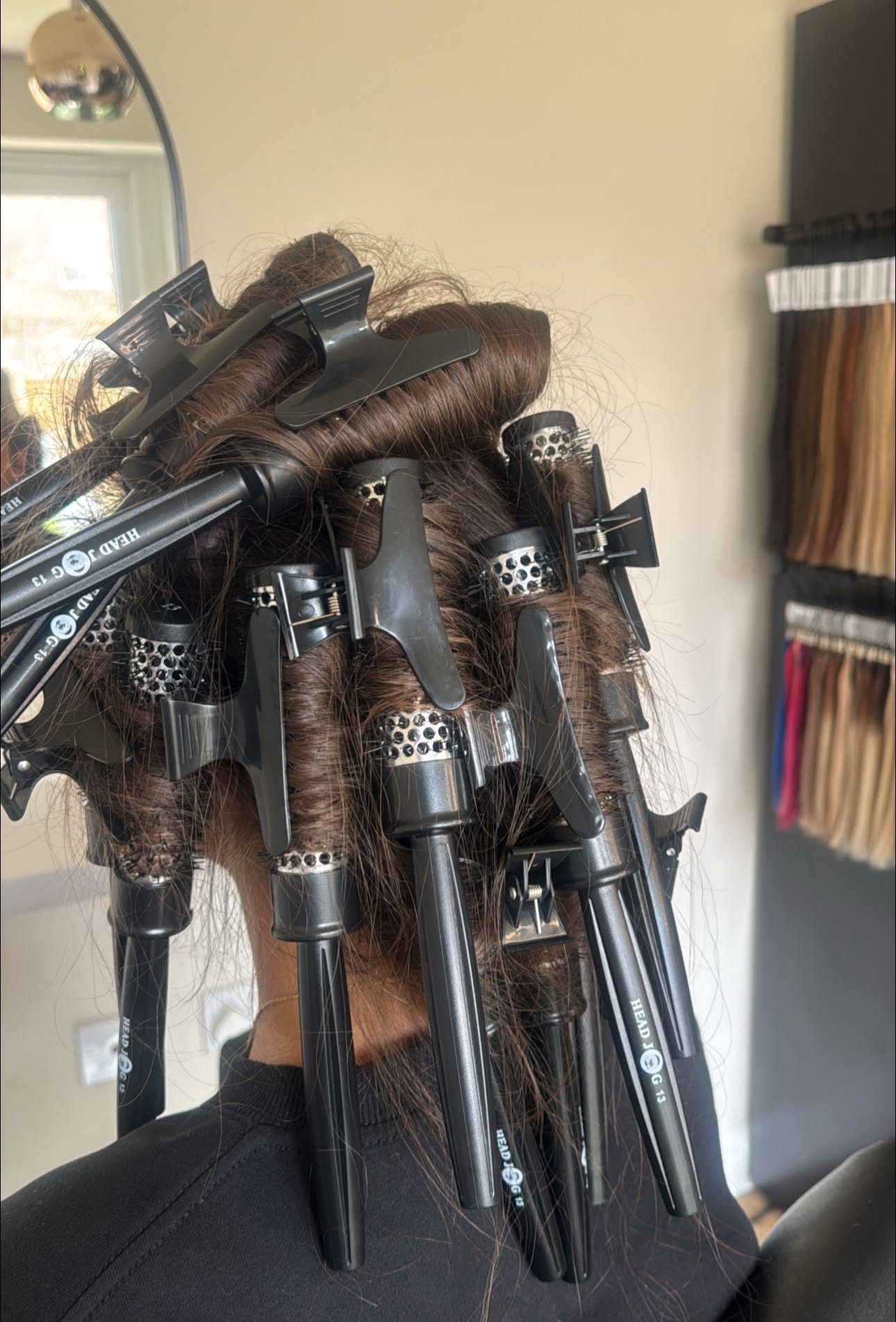 Hair set in rollers during a bouncy blow dry